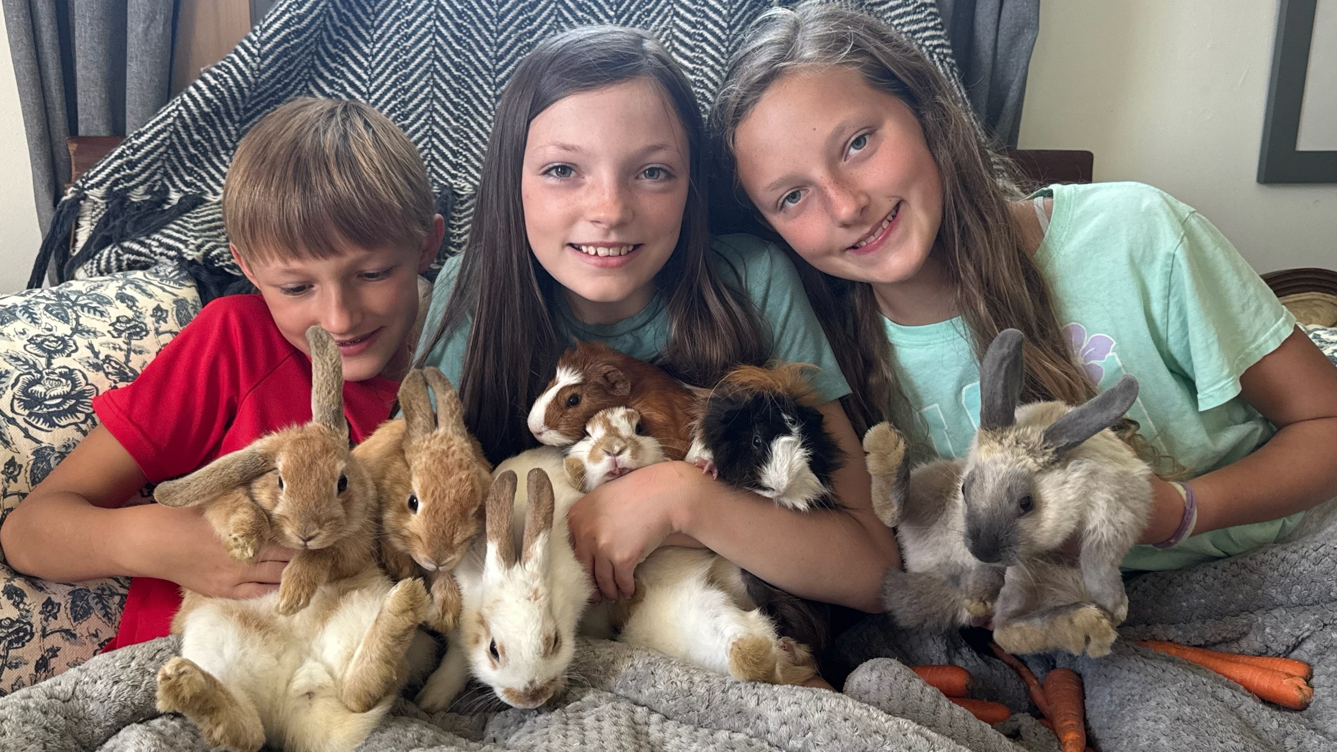 Children with animals at Blue Iris Farm